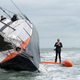 Illustration for article titled Spectacular stunt: Man runs up 98-foot ship mast and jumps into the sea